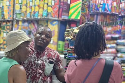 African custom clothing making experience with fabric tour